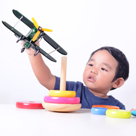 Baby boy playing with toysの写真素材