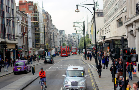 London, UK  March 28 2014   Scene taken at Oxford Circus  Oxford Circus is the busy intersection of Oxford Street  A40  and Regent Street in the West End of London のeditorial素材