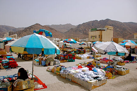 Mecca, Saudi Arabia - May 3 2007: Local market selling clothes and carpetsのeditorial素材