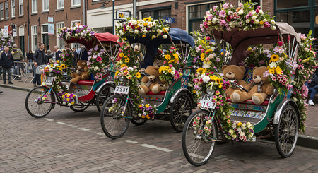 Traditional Dutch tricycle with flowers at the annual flower parade.