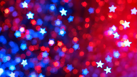 An abstract image featuring a blurred background of red and blue bokeh lights.  The lights are predominantly circular, with several star-shaped lights interspersed throughout. The colors are vibrant and intense, with a gradient effect transitioning from a predominantly blue area to a predominantly red area. The overall mood is festive and celebratory. The image has a soft, dreamy quality due to the out-of-focus nature of the lights.  The star shapes are consistently white or light-colored against the red and blue backgrounds.の写真素材