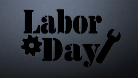 Black Labor Day text with gear and wrench icons on a dark gray background.  Simple stencil style.の写真素材