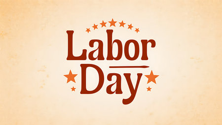 Red Labor Day text on a beige textured background.  Orange stars and a small line graphic are included in the design.  The style is vintage and simple.の写真素材
