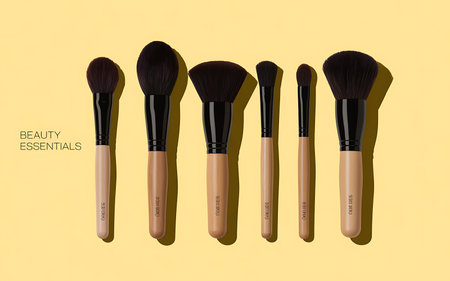 Set of makeup brushes on yellow background. Flat lay, top view.の写真素材