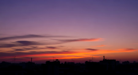 beautiful sunset over the city, orange and purple colors, panoramaの写真素材