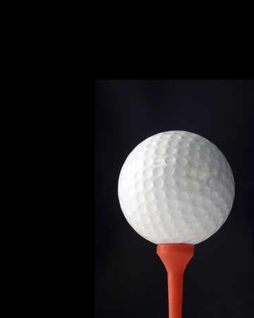 Golf ball on blackの写真素材