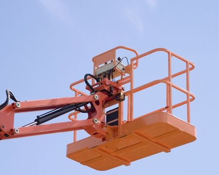 Hydrolic platform against blue skyの写真素材