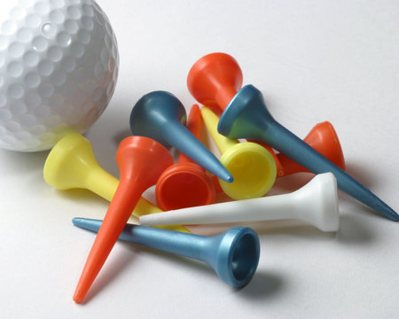 Golf ball and tees on whiteの写真素材