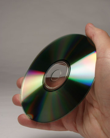 Hand holding compact disc