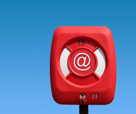 Email symbol on life ring with sky background