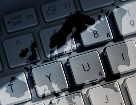 Map outline of Europe overlaid onto computer laptop keyboardの写真素材