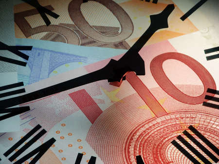 Clock face overlaid on to Euro bank notes. Concept: time is money.の写真素材
