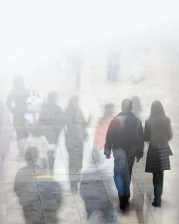 Crowd of shoppers with faded lighting effect.の写真素材