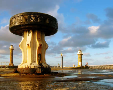 Close-up view of old capstan on Whitby pier. Taken in afternoon sunlight.の写真素材