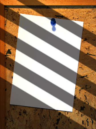Paper on notice board with shadow effectの写真素材