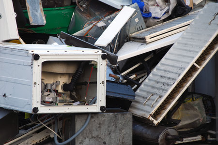 Close-up of scrap metal pile in junk yard
