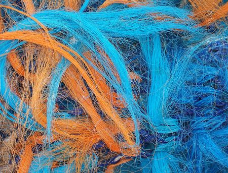 Close-up of yellow and blue fishing netsの写真素材