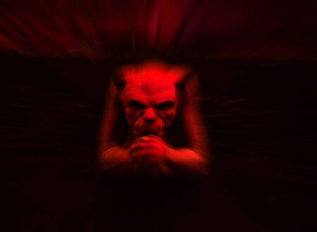 Red gargoyle statue with zoom blur for effectの写真素材