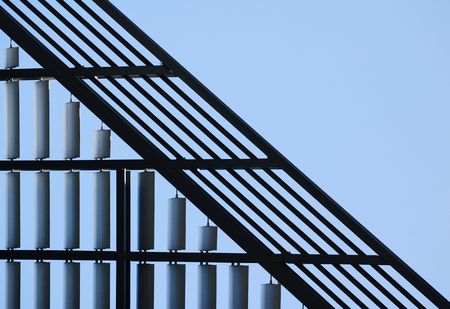 Silhouette of architectual detail on building against blue skyの写真素材
