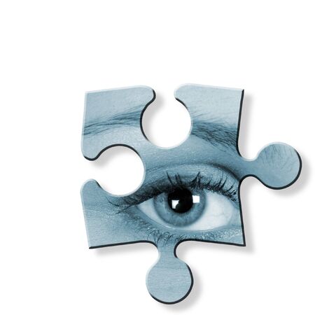 Blue toned jigsaw piece of woman's eye on whiteの写真素材
