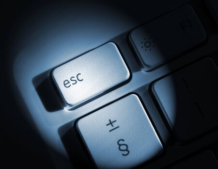 Spolight effect applied to laptop escape key の写真素材