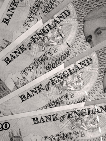 Sepia toned close-up of twenty pound notesの写真素材