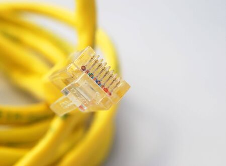Closeup of internet cable focussed on wires in plugの写真素材