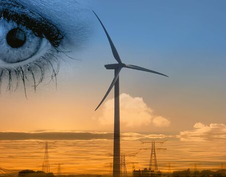 Conceptual image composite of eye and wind generatorの写真素材