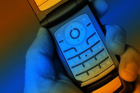 Man holding cellphone overlaid with vibrant colors