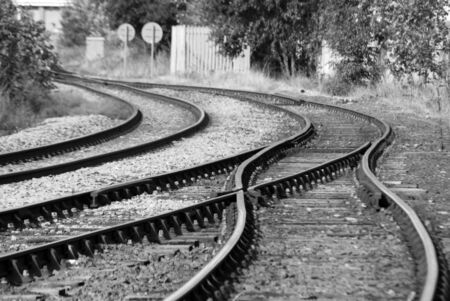 Black and white image of deserted railway trackの写真素材