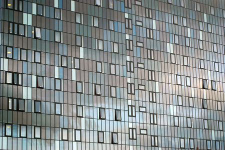 Close-up of glass office building in city