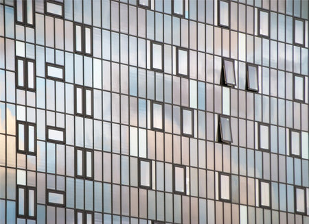 Close-up of glass fronted city office block
