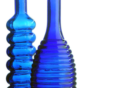 Two decorative blue bottles over white backgroundの写真素材