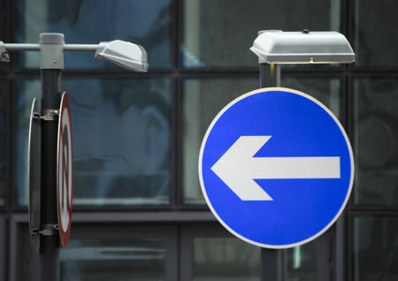 UK road traffic direction sign on urban road