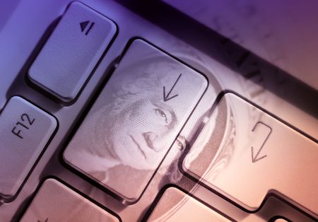 Computer arrow keys overlaid with US Dollarの写真素材