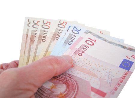 Man holding Euro bank notes over white