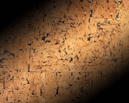 Close-up of texture on cork pin board with shadow effectの写真素材