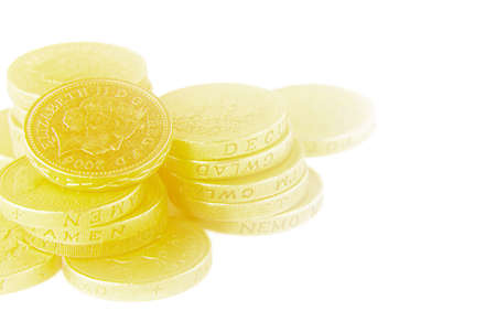 UK pound coins on white with soft focus effectの写真素材