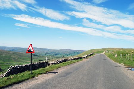 Warning sign on deserted Yorkshire Dales roadの写真素材