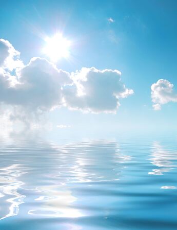 Cloudy blue sky with sun and simulated water reflectionの写真素材