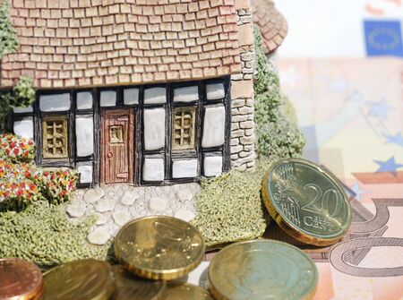 Real estate concept showing Euro currency with house modelの写真素材