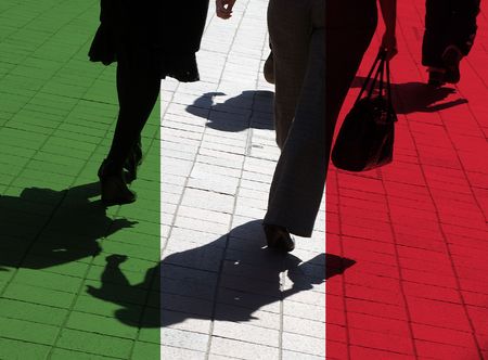 Italian flag overlaid over silhouetted pedestriansの写真素材