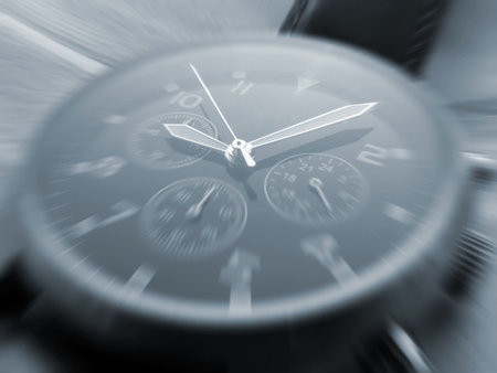 Closeup of watch face with zoom effect focused on hands