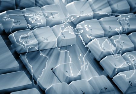 World outline map overlaid over computer keyboardの写真素材