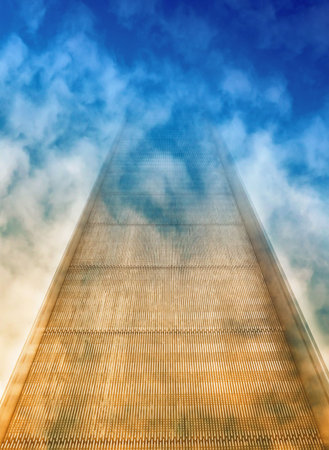 Fanyasy concept showing escalator disappearing into cloudsの写真素材