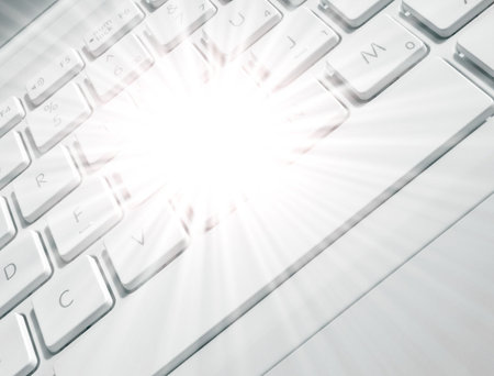 Close up of laptop keyboard with flare effect