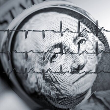 American dollar note overlaid with ECG graphの写真素材
