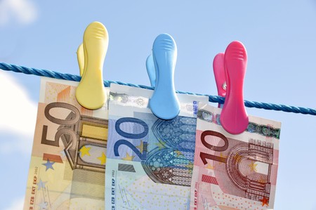 Money concept showing Euro currency on washing lineの写真素材