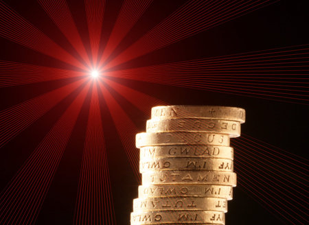 Stack of coins with red flare effectの写真素材