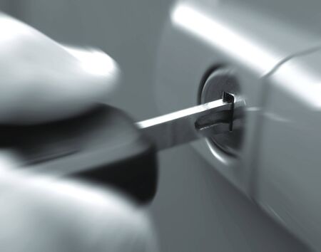 Closeup of car key in lock with zoom effectの写真素材